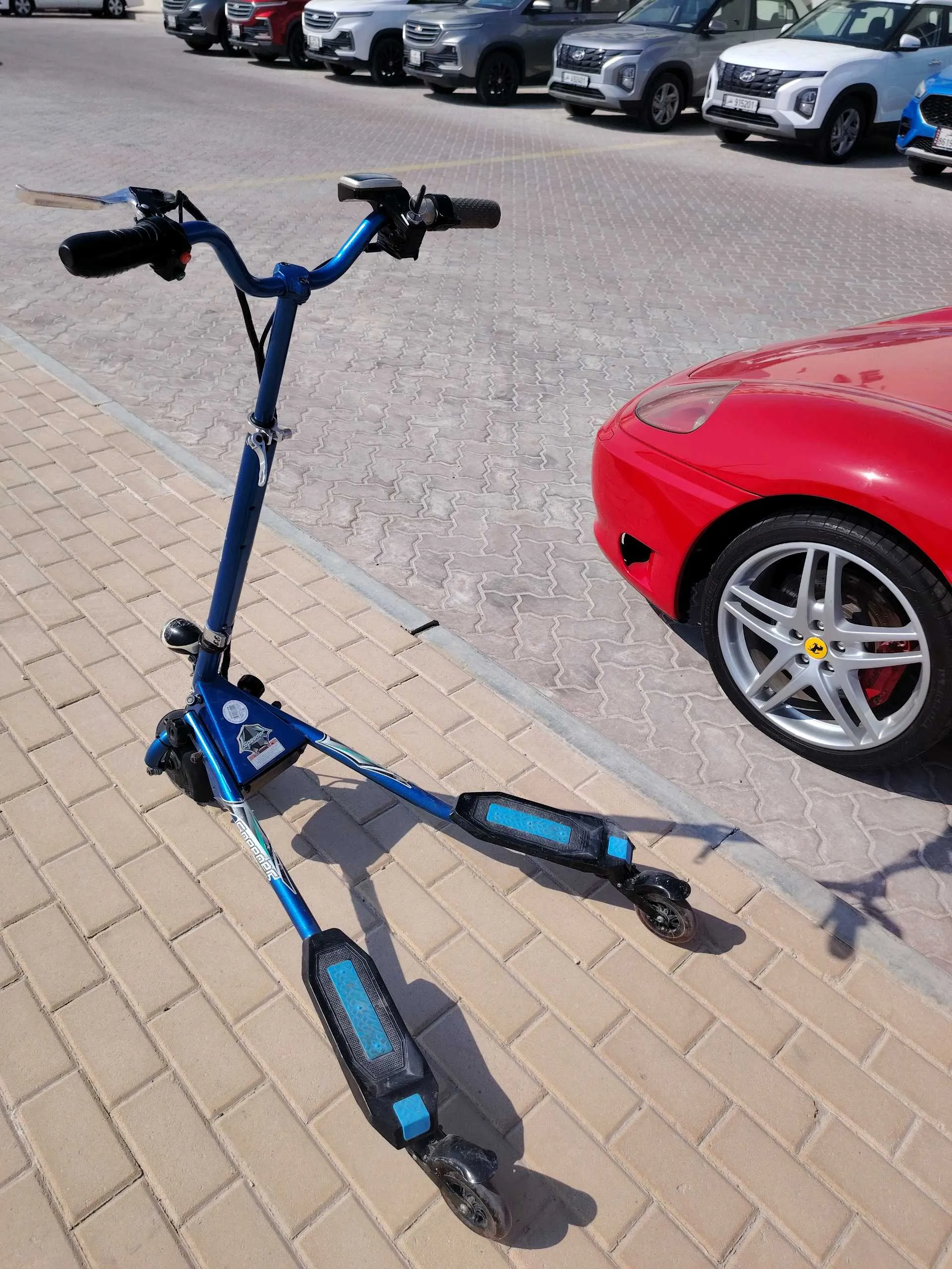 THREE WHEELED SCOOTER